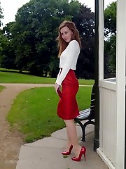 Hot red head Sophia steps out the office on her lunch break to parade around the park in a sexy...