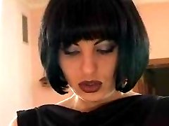 Horny bitch in black evening outfit fucks her male slave with killer strapon