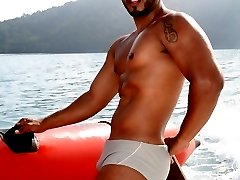 Unshaved sexy twink Matheus showing off his tattooed body and fuckable ass on a boat