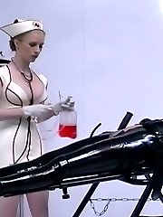 Domina in nurse latex uniform training pretty female slave in black latex suit