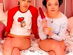 Two appealing teen lesbians licking their wet beavers in 69 position