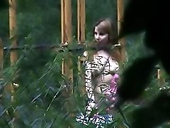 Outdoor voyeur cam movies of a changing babe