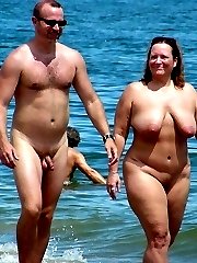 Voyeur pics of lovers making love in the at their local nudist beach