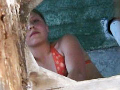 Beach girl pees onto spy cam planted in the john