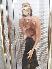 Blonde in a Bathroom Having a Shower with Soap Bubbles All Over