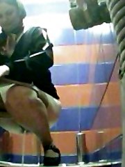 Hot babes emptying their bladders in mall toilet