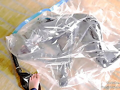 Adorable Latex girl on vacuum bag and mask, breathplay Adorable Latex girl on vacuum bag and mask, breathplay