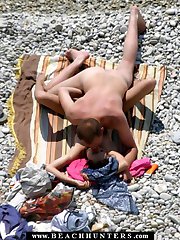 Happy nudist couple have slow sex near the water