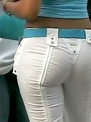 The charming bimbo in the denim hot pants of the white color was spied in the streets