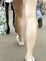 Girl wearing tan pantyhose up skirt