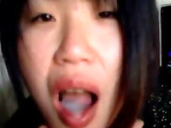 Asian babe tugging and sucking