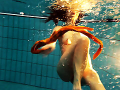 Sexy orange stocking of Markova underwater