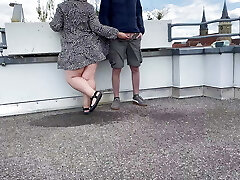 Gorgeous pissing mother-in-law helps son-in-law urinate on the top of the parking lot