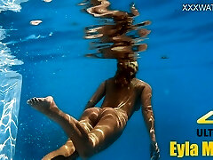 Eyla Moore, a famous model, glides elegantly through the water Eyla Moore, a famous model, glides elegantly through the water