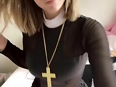 Pious girl with a cross shows her tits and pussy