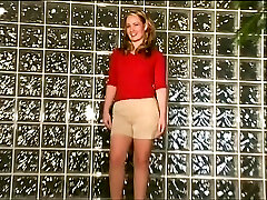 Small-chested blonde puts on strip taunt in bedroom