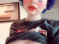 Depressed butterfly goth lady plays with her boobs