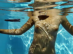 Small tits blondie babe Sofie Otis swimming naked