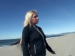 Playing with big mounds at the beach and screwing her hole at home