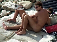 Breasty slut deepthroating cock on a beach