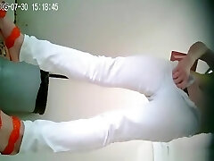 Asian female in white pants pissing Asian female in white pants pissing