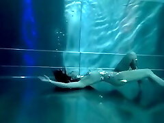 Bond Girl, underwater stunts, nerd dame, high heels glamor and underwater swimming retro fashion 