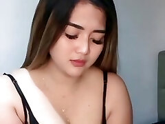 Lisda's latest hot wearing a voluptuous dark-hued bikini