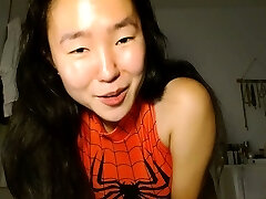 Clean-shaved Asian milf squirting while masturbate on webcam