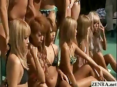 Tanned group of Japanese nubiles pose for a stripped to the waist pool photo shoot
