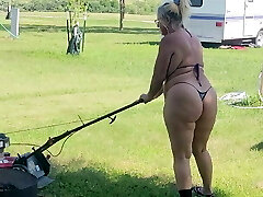 Got back to find wifey mowing in a thong bikini, her ass and thighs jiggling with every step 