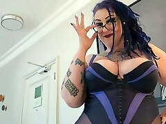 Bbw MiLF with big tits and tattoos gives pierced beef whistle a hand job.