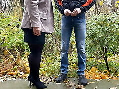 Torrid milf in pantyhose and skirt holding fellow's cock outdoors while pissing Torrid milf in pantyhose and skirt holding fellow's cock outdoors while pissing