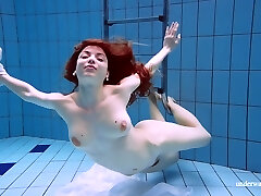 Red-haired Marketa In A White Dress In The Pool