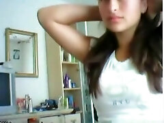 Cute brunette girl plays with her big titties and shaved vagina on cam