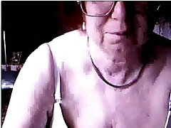 Ugly four eyed granny from Germany unveils her time worn cunt on webcam