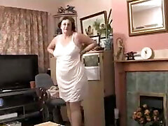 British granny strips nude for you