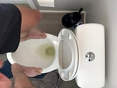 High on pot and fit to bust standing on public toilet desperate to piss open wide swallow up piss slut