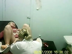 Hidden cam video of blond lady on the gynecologist chair in the clinic