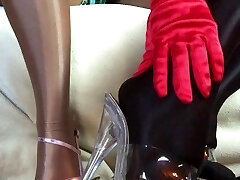 Sensual teasing close up legs and soles in Shiny glossy pantyhose and high heels. Sensual teasing close up legs and soles in Shiny glossy pantyhose and high heels.