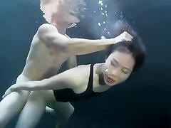 swimsuit lady sex with a guy underwater