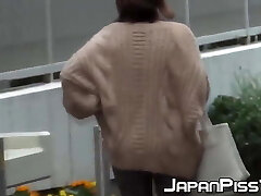 Horny Japanese cuties pissing in the streets Horny Japanese cuties pissing in the streets