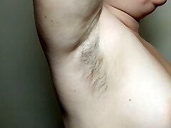 Ellie shows her furry armpits and plays with them
