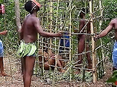 Somewhere in west Africa, on our annual jamboree, the king pummels the most fantastic maiden in the cage while his Queen and the guards are watching