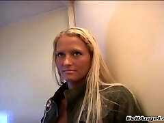 Tattooed blonde with all-natural breasts getting her anal inserted with toys