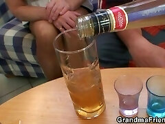 Blonde grandma takes two big cocks at once