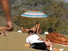Plucky masturbation on a crowdy beach