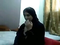 Middle East fledgling brunette nympho in traditional gown shows off her tits