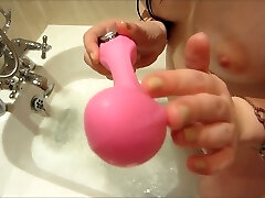 My marvelous girlfriend is playing with her toys in the shower