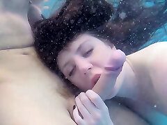 Super adorable honey gives eager blowjob under the water