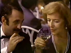 Black-haired Brie in a movie providing service to all the high society